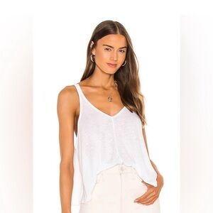 #156 Free People White Kara swing Tank Top with racer back design.